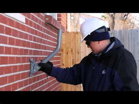 mounting metal bracket on brick exterior|sticking things on brick walls.